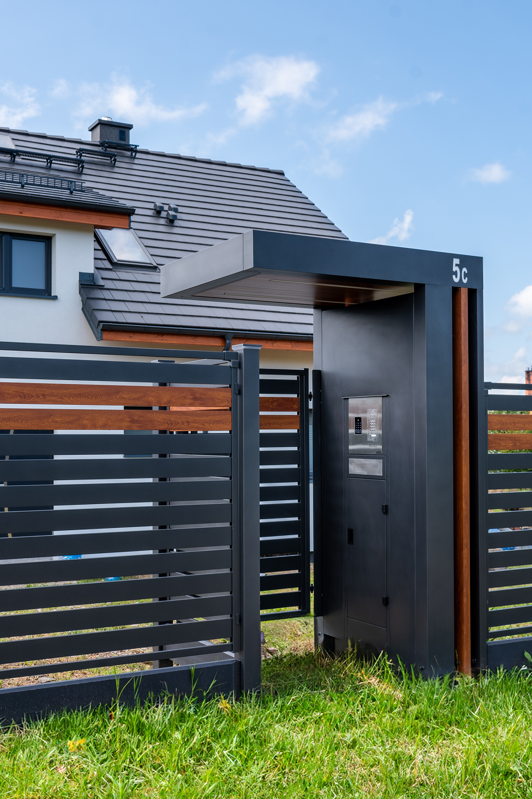 6 | a metal gate with a roof over it